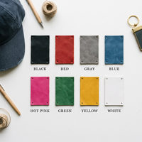 Flat lay of eight leather patch color swatches available for the custom football hat: black, red, gray, blue, hot pink, green, yellow, and white