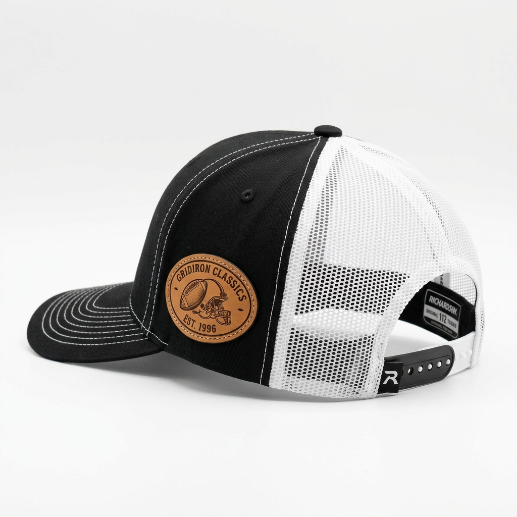 Side and back profile of a custom Richardson 112 black snapback hat with white mesh, showing mid-profile structured fit and adjustable snap closure